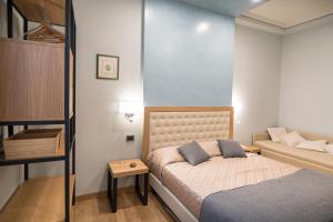 Ένα ή περισσότερα κρεβάτια σε δωμάτιο στο Brunelli B&B