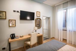 TV a/nebo společenská místnost v ubytování Brunelli B&B