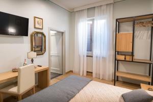 Postel nebo postele na pokoji v ubytování Brunelli B&B