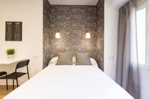 Posteľ alebo postele v izbe v ubytovaní LU&CIA City Beach Malagueta 2