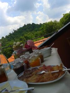 a table with a plate of food on a table at Bosco Romagno in Cividale del Friuli