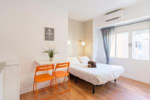Łóżko lub łóżka w pokoju w obiekcie LU&CIA City Beach Malagueta 6