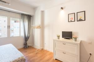 Łóżko lub łóżka w pokoju w obiekcie LU&CIA City Beach Malagueta 6