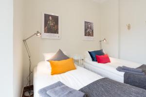 Postel nebo postele na pokoji v ubytování LU&CIA CERVANTES