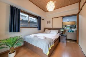Postel nebo postele na pokoji v ubytování Uhome Akihabara Apartment 3