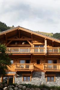 a large wooden house with a balcony on it at B&B Boutique Chalet Nono in Montriond
