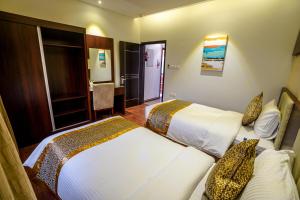 Postel nebo postele na pokoji v ubytování Meral Oasis Resort Taif