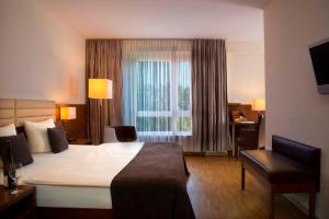 Postel nebo postele na pokoji v ubytování Hotel Simon's Plaza