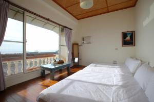 Postel nebo postele na pokoji v ubytování Mama Tian Homestay