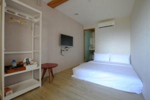 Postel nebo postele na pokoji v ubytování Mama Tian Homestay