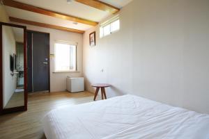 Postel nebo postele na pokoji v ubytování Mama Tian Homestay