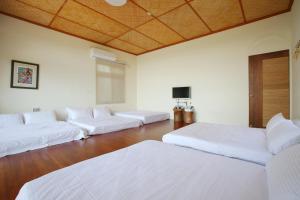 Postel nebo postele na pokoji v ubytování Mama Tian Homestay