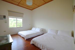 Postel nebo postele na pokoji v ubytování Mama Tian Homestay