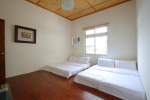 Postel nebo postele na pokoji v ubytování Mama Tian Homestay