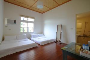 Postel nebo postele na pokoji v ubytování Mama Tian Homestay