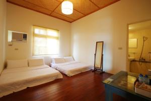 Postel nebo postele na pokoji v ubytování Mama Tian Homestay