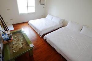 Postel nebo postele na pokoji v ubytování Mama Tian Homestay