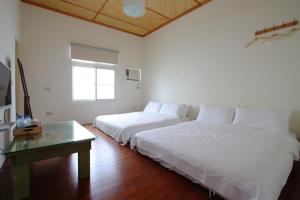 Postel nebo postele na pokoji v ubytování Mama Tian Homestay