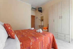 Postel nebo postele na pokoji v ubytování Hotel Giove dipendenza Hotel Fiamma