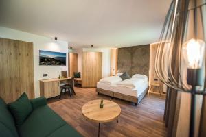 A bed or beds in a room at Vitaurina Royal Hotel