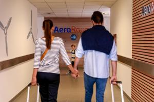 a woman and a man standing in a hallway at AeroRooms in Prague