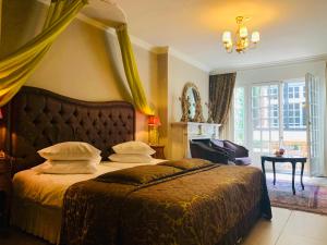 Postel nebo postele na pokoji v ubytování Boutique Hotel Die Swaene