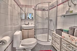 a bathroom with a toilet and a shower and a sink at Luxury with sea view in Pula