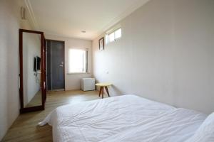 Postel nebo postele na pokoji v ubytování Mama Tian Homestay