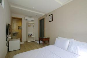 Postel nebo postele na pokoji v ubytování Mama Tian Homestay