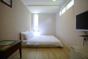 Postel nebo postele na pokoji v ubytování Mama Tian Homestay