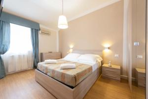 Postel nebo postele na pokoji v ubytování Hotel La Pace