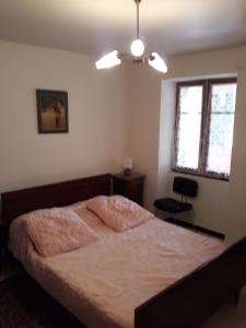 a bedroom with a bed and a chair in it at Theana in Cazilhac