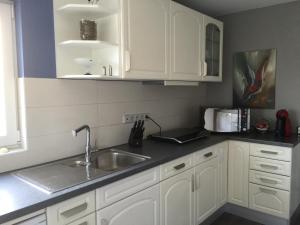 Kuchyň nebo kuchyňský kout v ubytování VIP Appartement