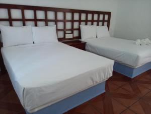 Postel nebo postele na pokoji v ubytování Hotel D Abril