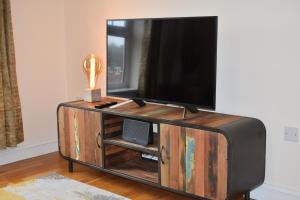 A television and/or entertainment centre at Urban Nest @Eastwater