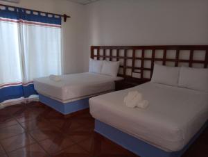 Postel nebo postele na pokoji v ubytování Hotel D Abril
