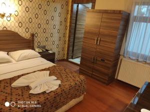 Postel nebo postele na pokoji v ubytování Hotel Bazaar
