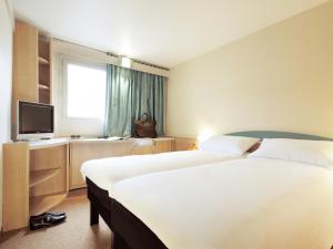 Postel nebo postele na pokoji v ubytování Hotel ibis Leiria Fatima