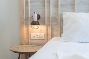 A bed or beds in a room at Livikon by the Sea