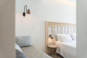 A bed or beds in a room at Livikon by the Sea