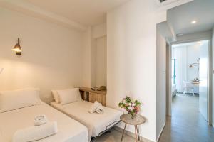 A bed or beds in a room at Livikon by the Sea