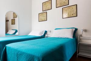 A bed or beds in a room at Casa↨di Amore e Psiche