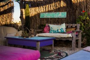 a living room with a couch and a table at Silent Arrow in Mitzpe Ramon