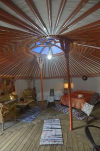 a room with a bed and a large tent at Xanadu Rural in Chiclana de la Frontera