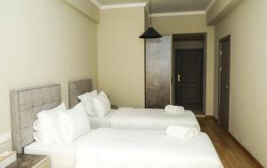 Postel nebo postele na pokoji v ubytování Teryan Pushkin Apart Hotel + 21 fotografií