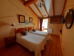 Postel nebo postele na pokoji v ubytování Hotel Rural El Perdigón