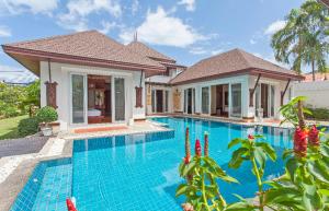 an image of a villa with a swimming pool at Thai style villa with very beautiful private pool in Kamala Beach