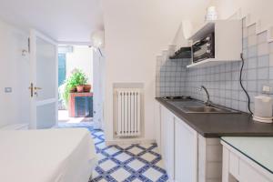 a kitchen with a sink and a counter top at Villa Elisa Holiday Home in Sorrento