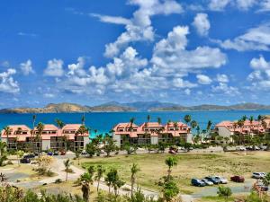 a view of the resort with a parking lot at Ocean Front Sapphire del Mar B-107 in St Thomas