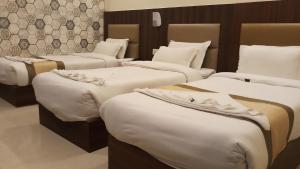Postel nebo postele na pokoji v ubytování Hotel Saayein Residency